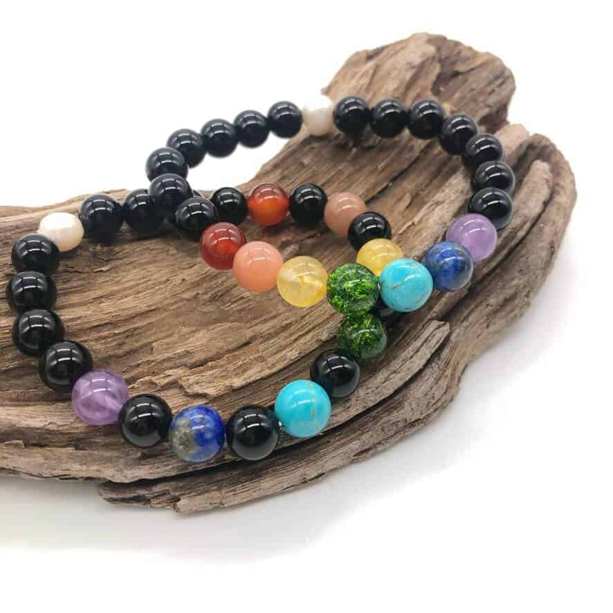 chakra bracelets on top of wood